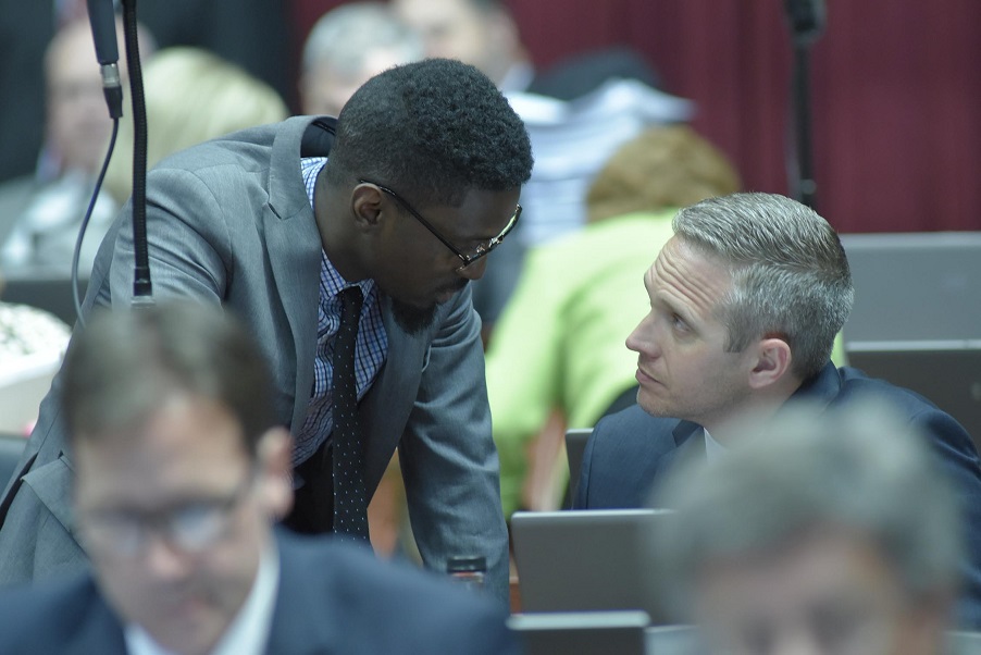 Representative Bruce Franks, Junior (left), talks about SB 43 with Republican colleague Nate Tate (photo; Tim Bommel, Missouri House Communications)